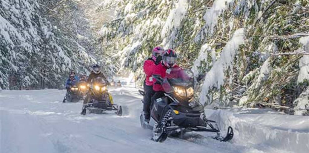 Guided snowmobile tour in the White Mountains, New Hampshire.