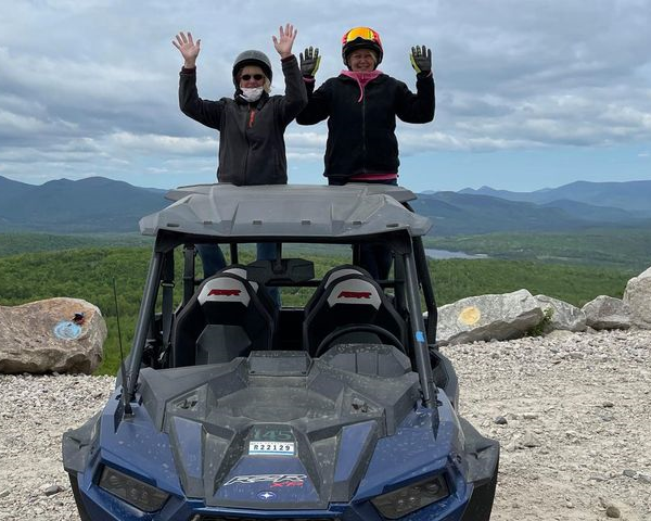 Couple enjoying ATV rental in the White Mountains of New Hampshire.