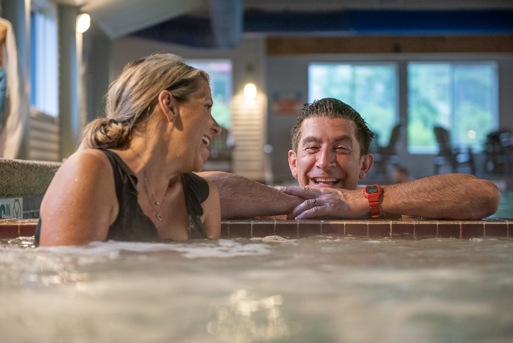 Couple in hot tub at Attitash Mountain Village
